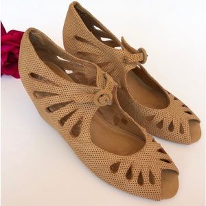 Jeffery Campbell peep toe perforated suede wedges.